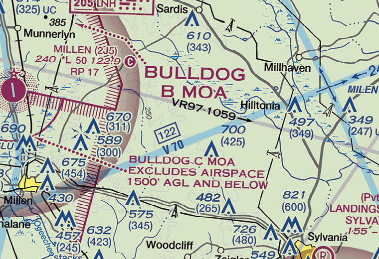Sectional chart excerpt showing the hatched magenta boundary of the Bulldog B MOA, a note that Bulldog C MOA excludes airspace 1500 feet AGL and below, a gray military training route labeled VR97-1059, and Victor airway V70 in blue.